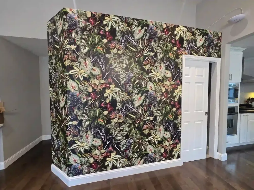 A floral wallpaper feature wall in a furnished interior